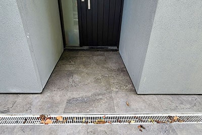 Outdoor tiles 60x60 grey marble style in front of door 